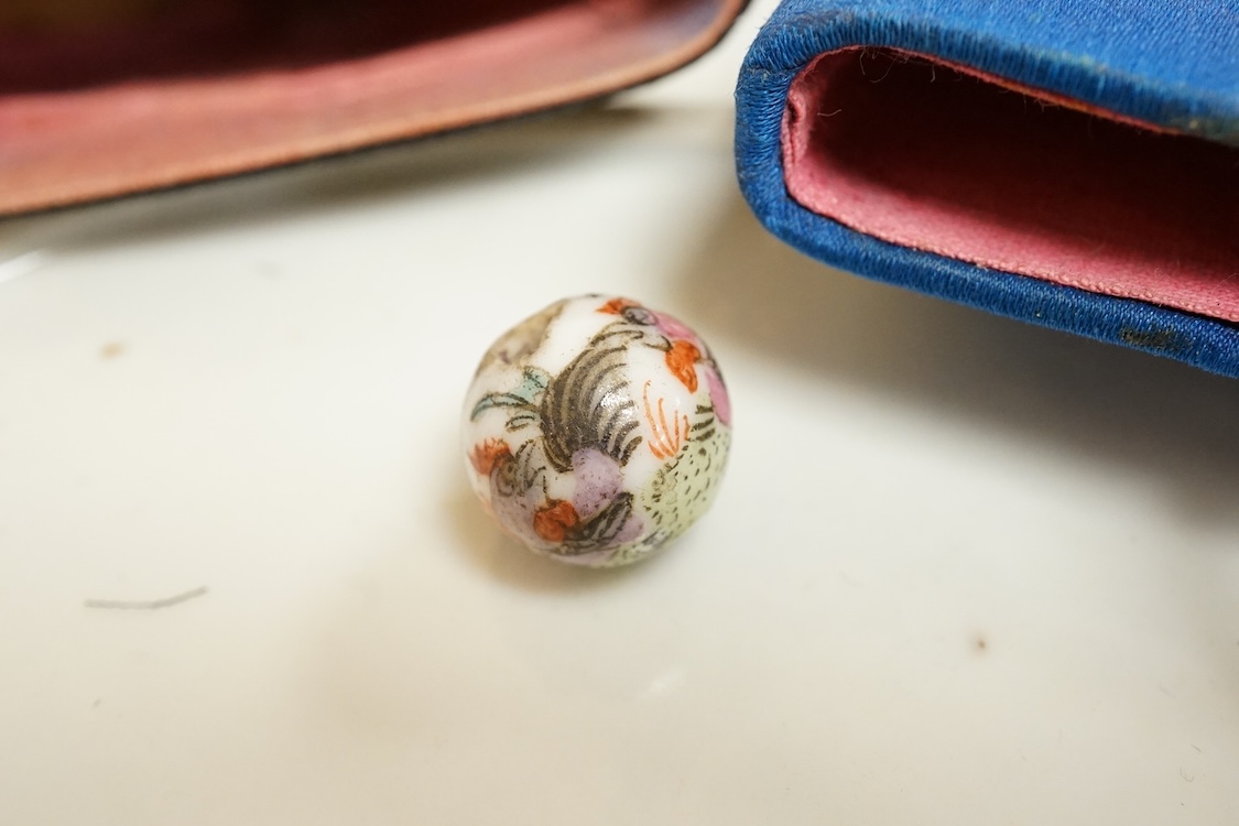 A Chinese embroidered spectacles case and an armorial oval miniature dish